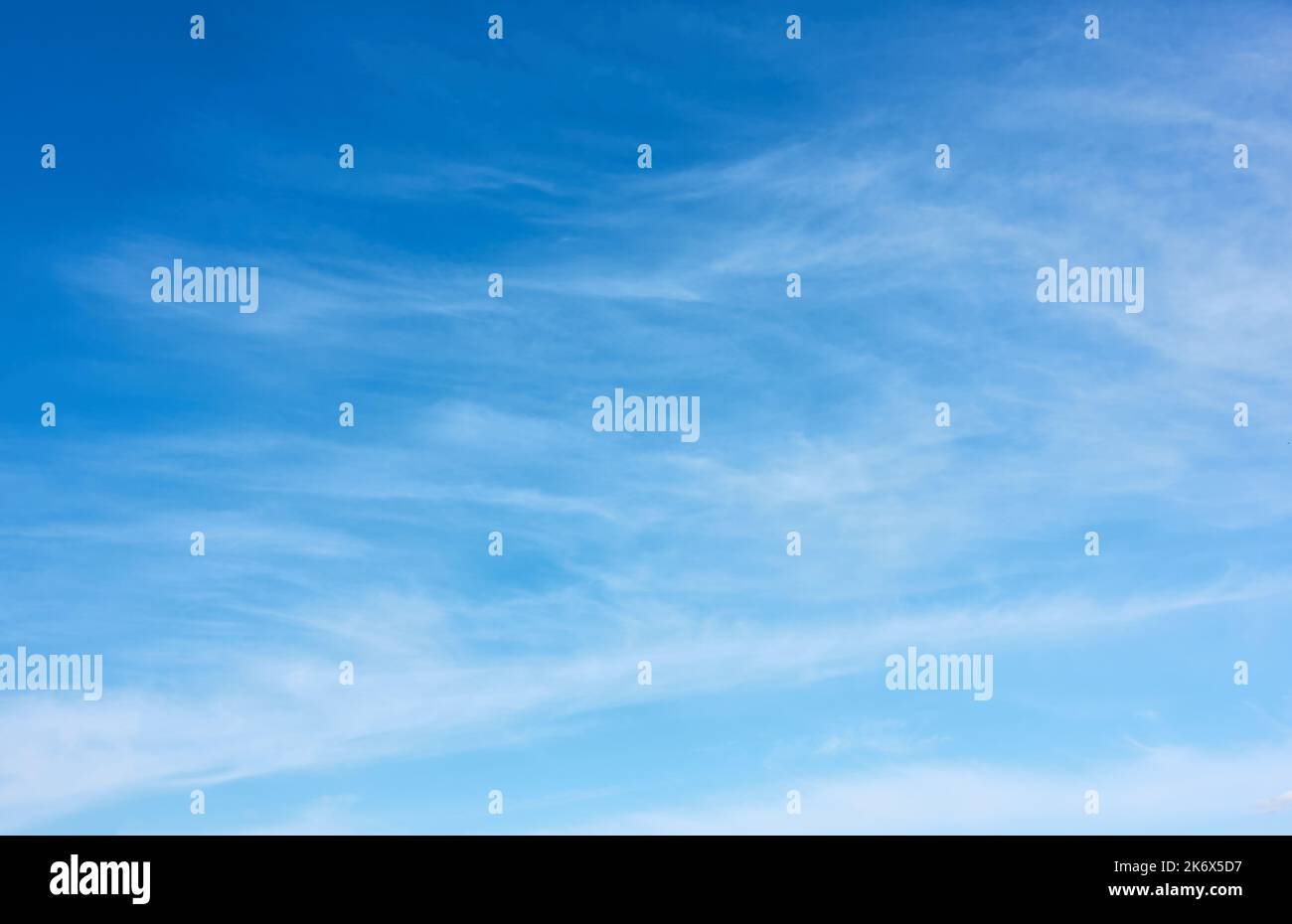 Blue sky with fleecy clouds  - vertical background with space for your own text Stock Photo