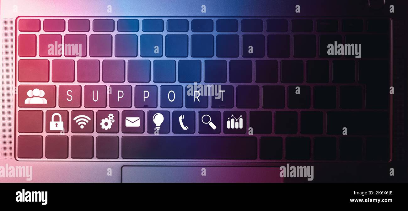Top view of laptop keyboard with contact us or customer support hotline ...
