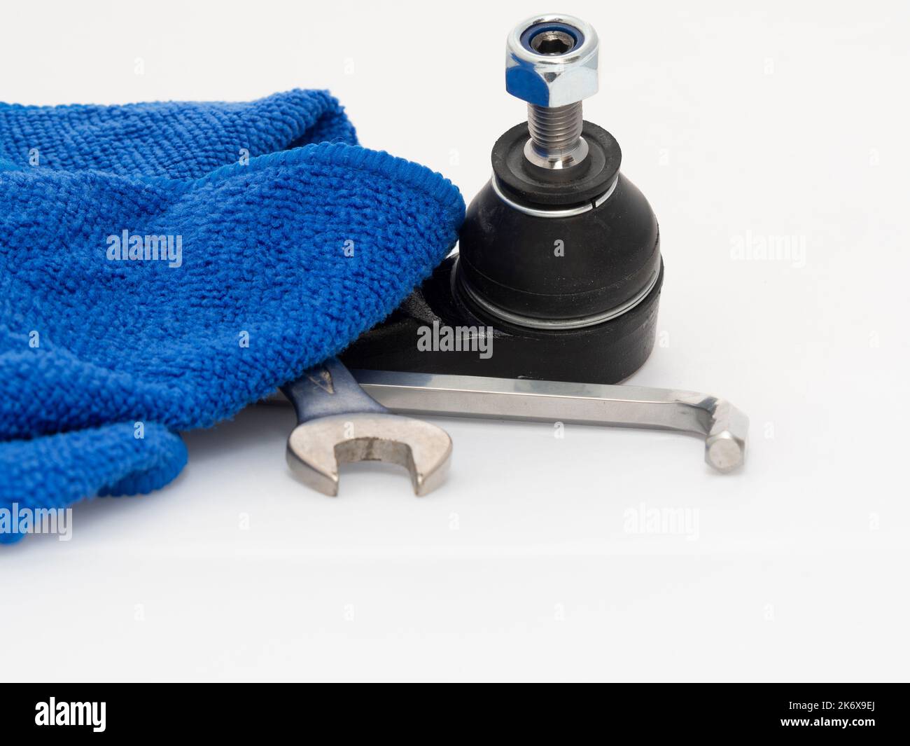 Car track rod end steering joint isolated against a white background