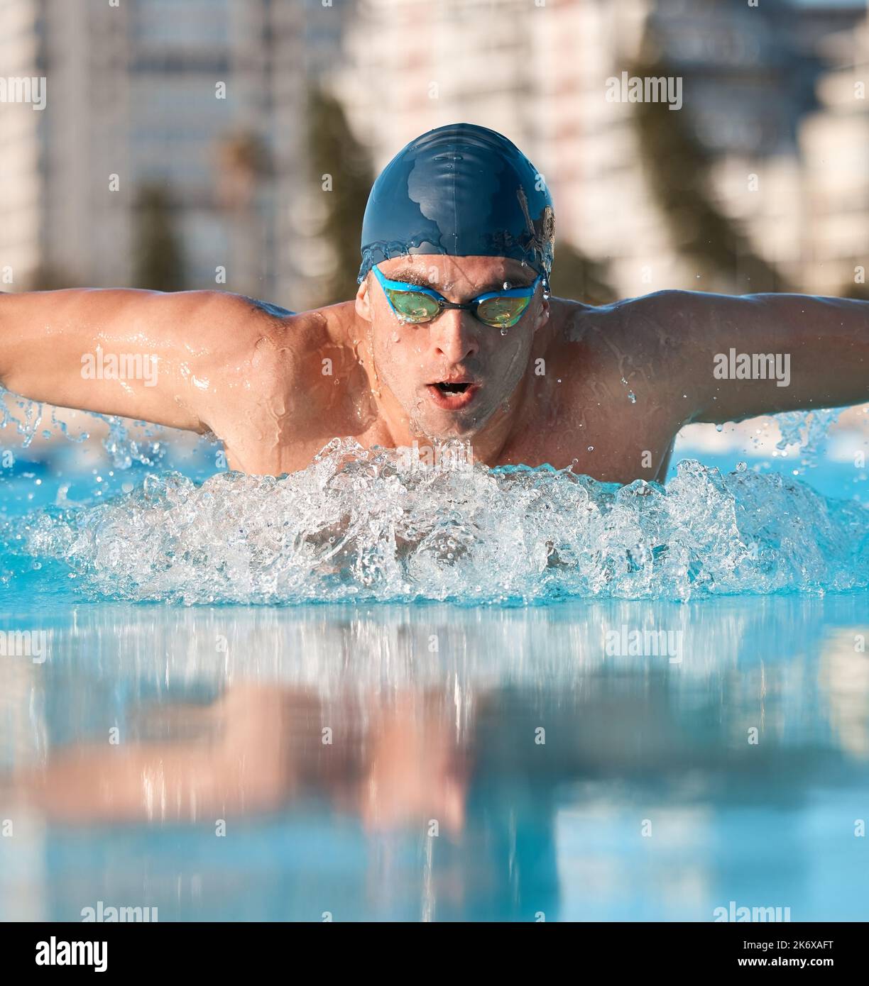 Power in every stroke. a handsome young male athlete swimming in an