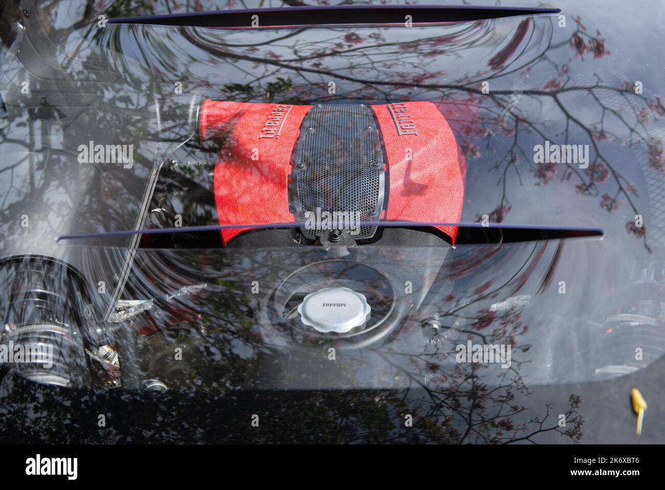 Atibaia - Brazil, October 7, 2022: Top view of Ferrari F8 Tributo V8 engine parked on the street. Mid engine rear drive sports car. Ferrari is an Ital Stock Photo