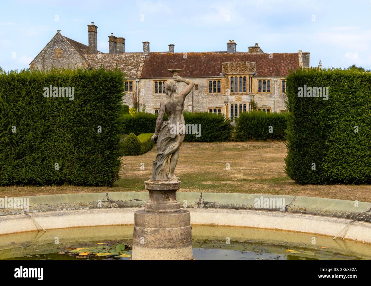 Pond Garden view towards Lytes Cary Manor house through the Seat Garden