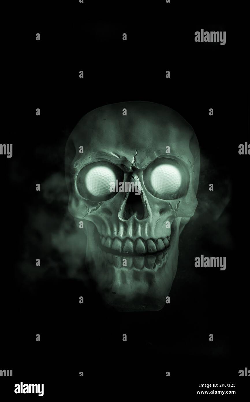 Glowing and smoking halloween skull Stock Photo