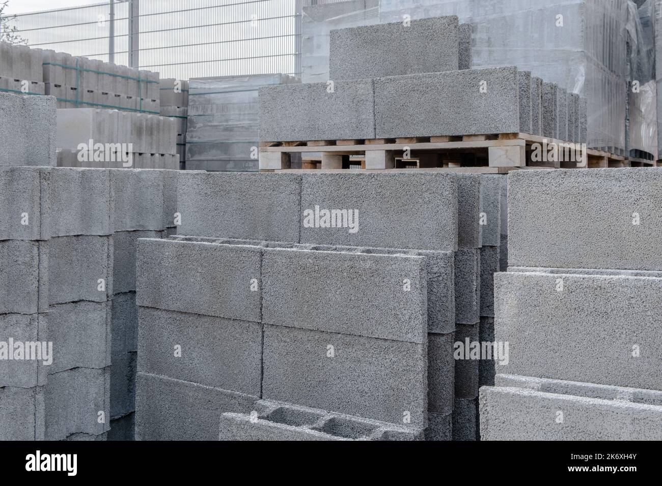 Stack of cement concrete Building cinder blocks brick on pallete in