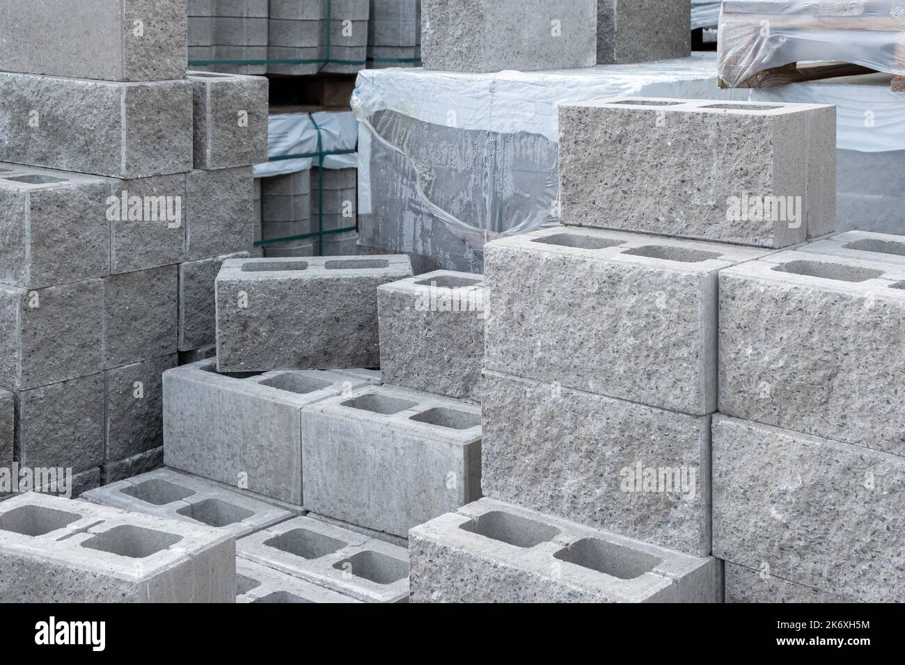Stack of cement concrete Building cinder blocks brick on pallete in