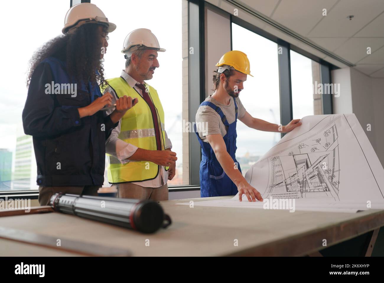 Blueprint Discussion Architect and construction engineer or surveyor discussion plans and ...