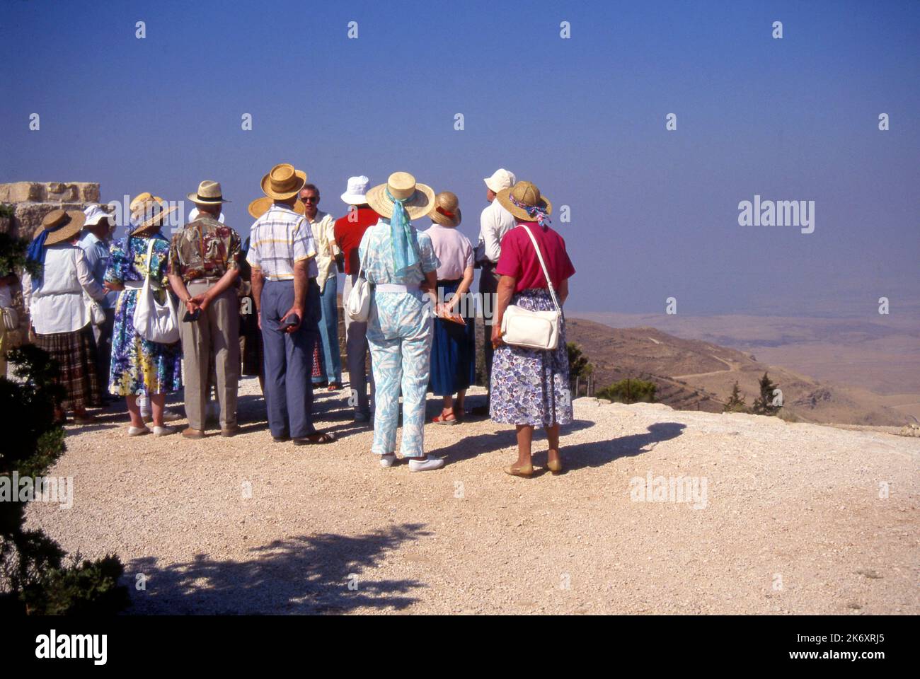 Group of tourists at the viewpoint on Mount Nebo, Jordan, where the bible states that Moses overlooked the promised land Stock Photo