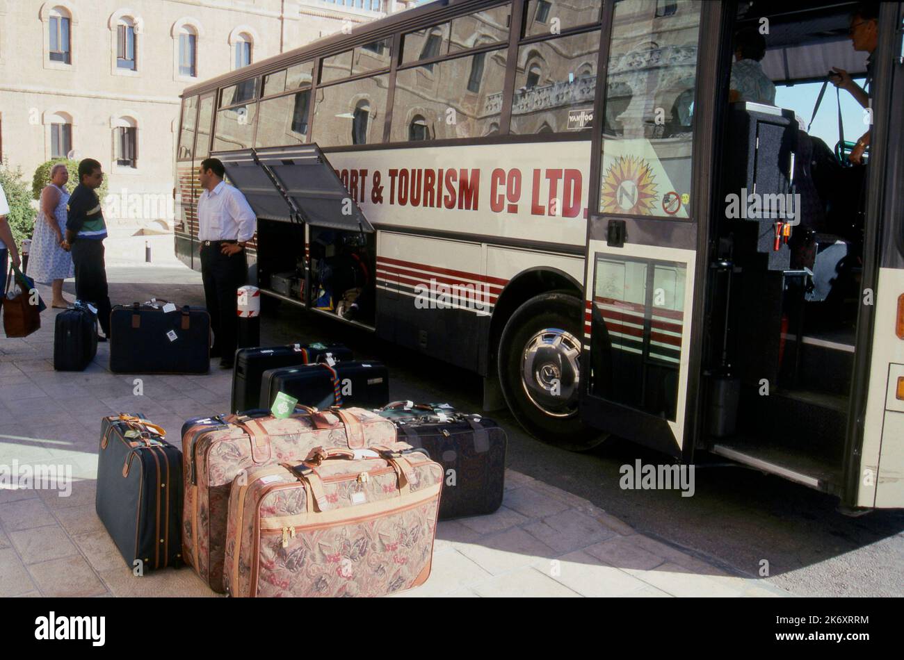 Luggage being loaded onto coach, Jerusalem, Israel for passengers on a ...