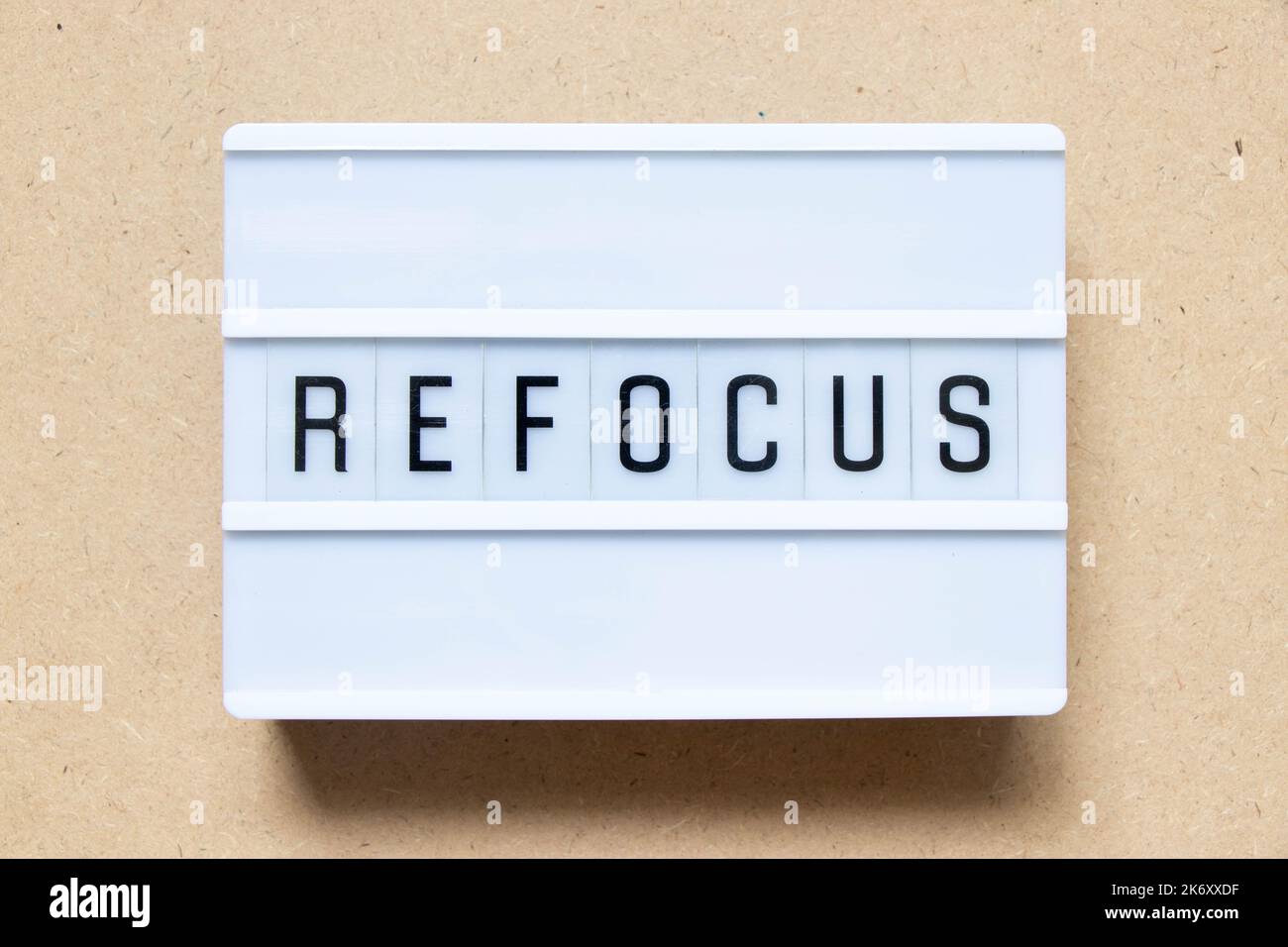 Lightbox with word refocus on wood background Stock Photo