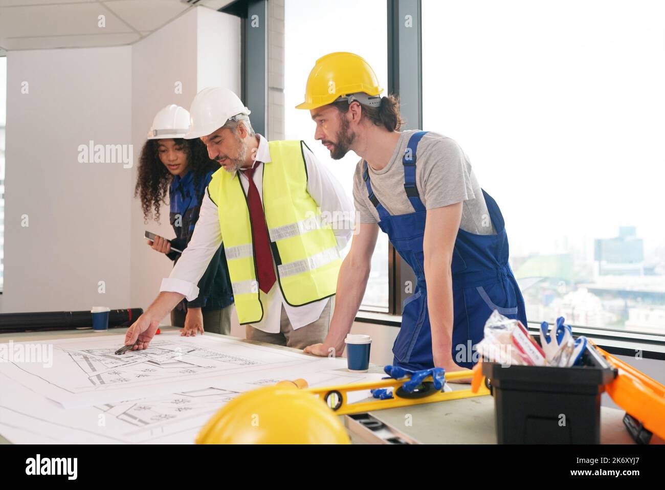 Blueprint Discussion Architect and construction engineer or surveyor discussion plans and ...