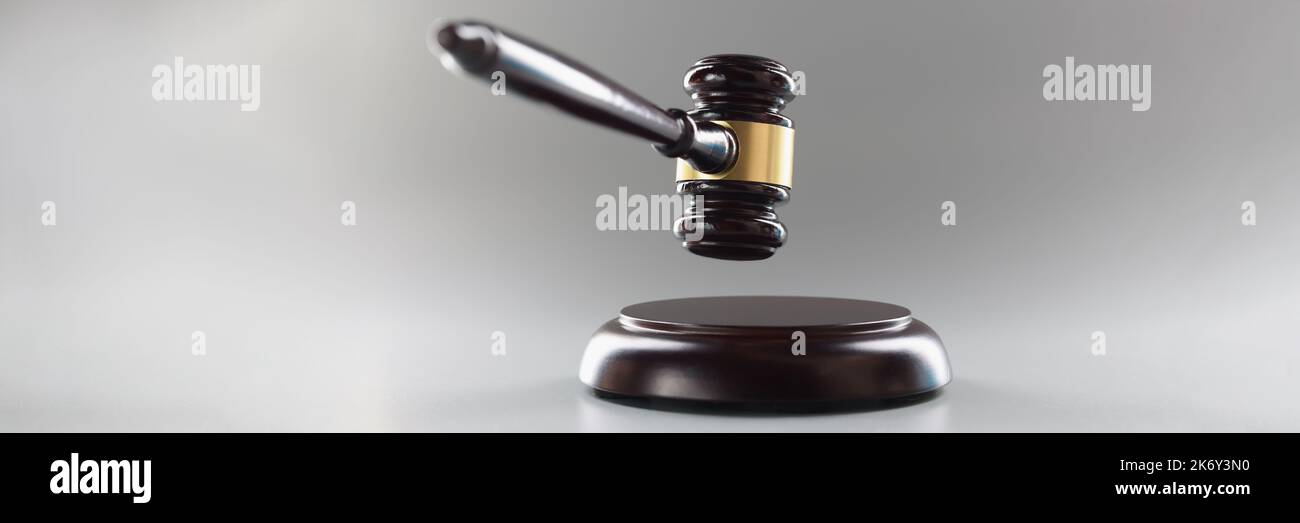 Brown wooden judge's gavel on a gray background Stock Photo Alamy