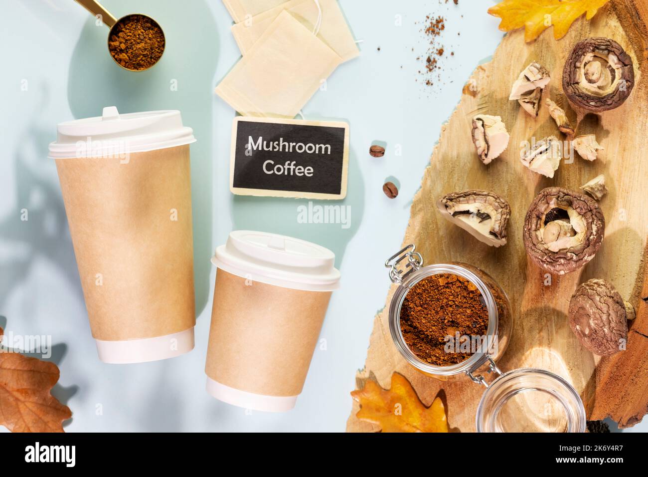 Coffee to go cups with pieces of dry mushrooms with chaga powder Stock Photo