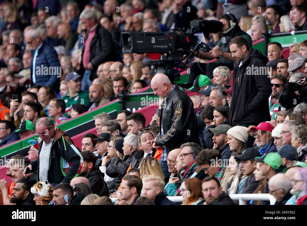 Harlequins fans leave after Leicester Tigers’ fourth try during the