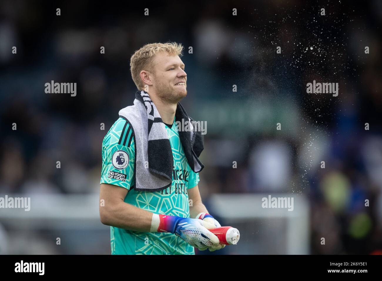 Aaron Ramsdale #1 of Arsenal squirts water towards the Leeds supporters after the Premier League match Leeds United vs Arsenal at Elland Road, Leeds, United Kingdom, 16th October 2022  (Photo by James Heaton/News Images) Stock Photo