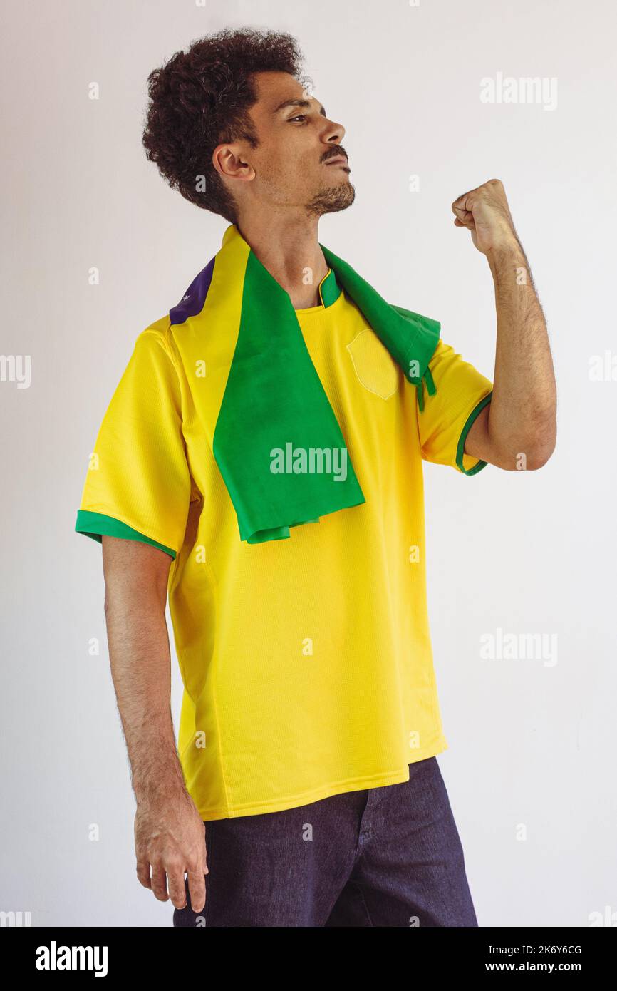 Brazilian Black Man Fan with Soccer Team Shirt Isolated on White. Sport