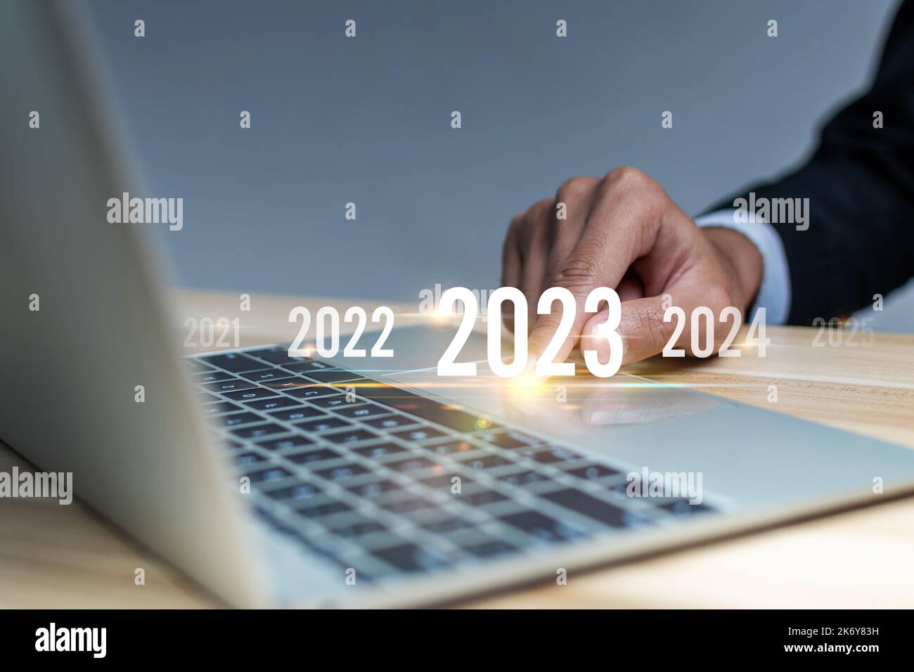 2023. businessman hand touching and pointing on year 2023 with digital ...