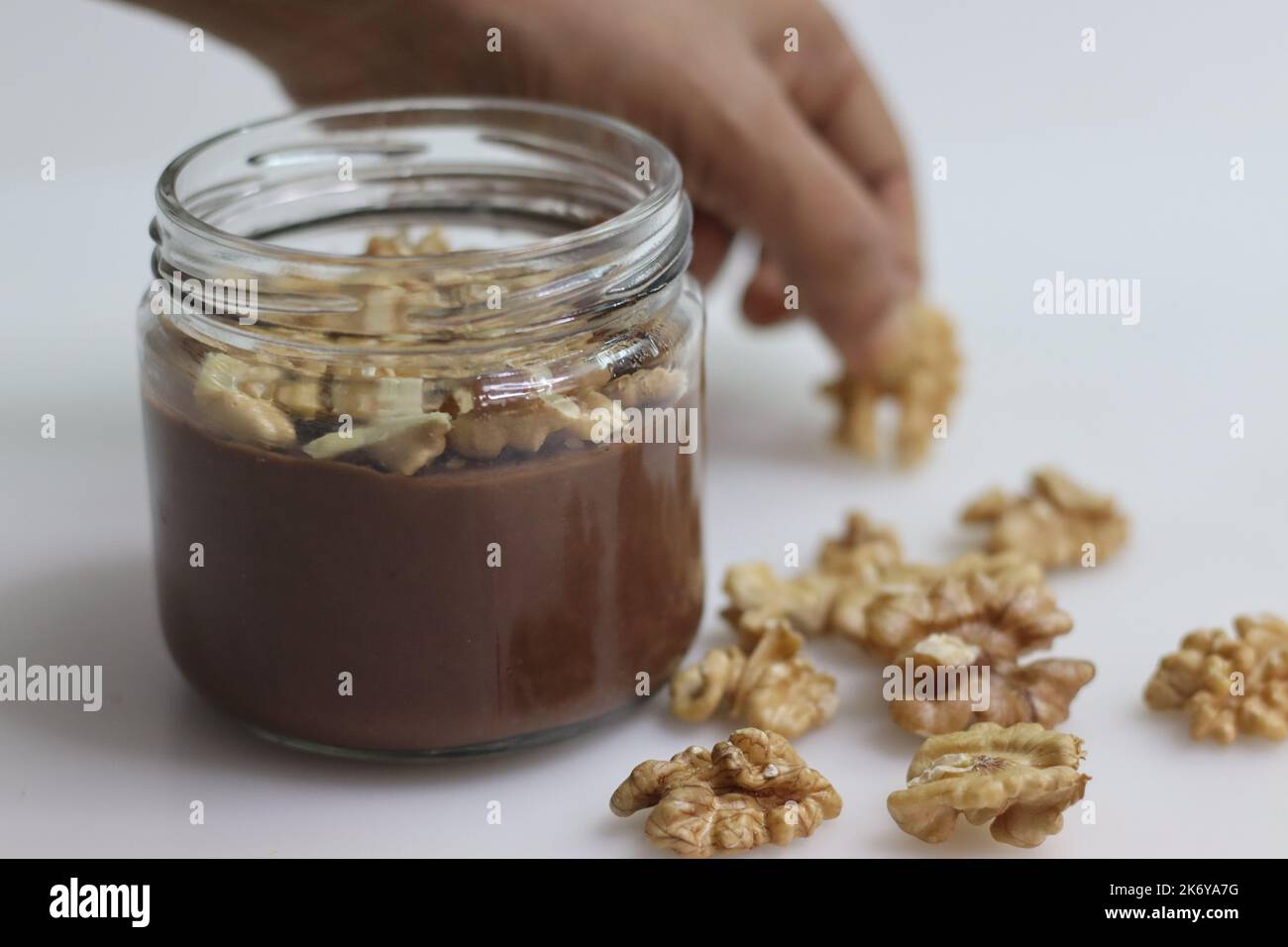 Chocolate walnut custard. Chocolate custard served with crushed walnuts. A quick and easy