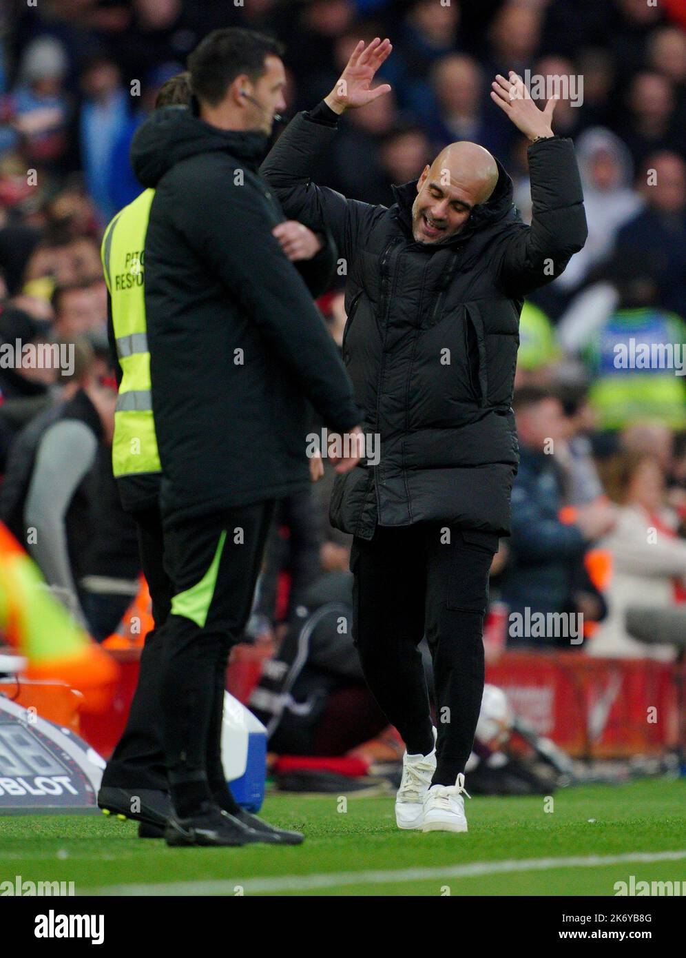 Manchester City manager Pep Guardiola gestures from the sideline during the Premier League match at Anfield, Liverpool. Picture date: Sunday October 16, 2022. Stock Photo