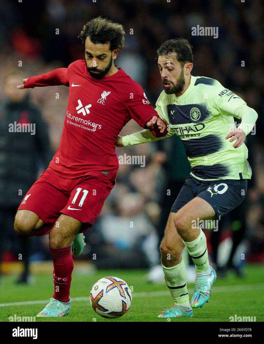 Liverpool's Mohamed Salah battles with Manchester City's Bernardo Silva