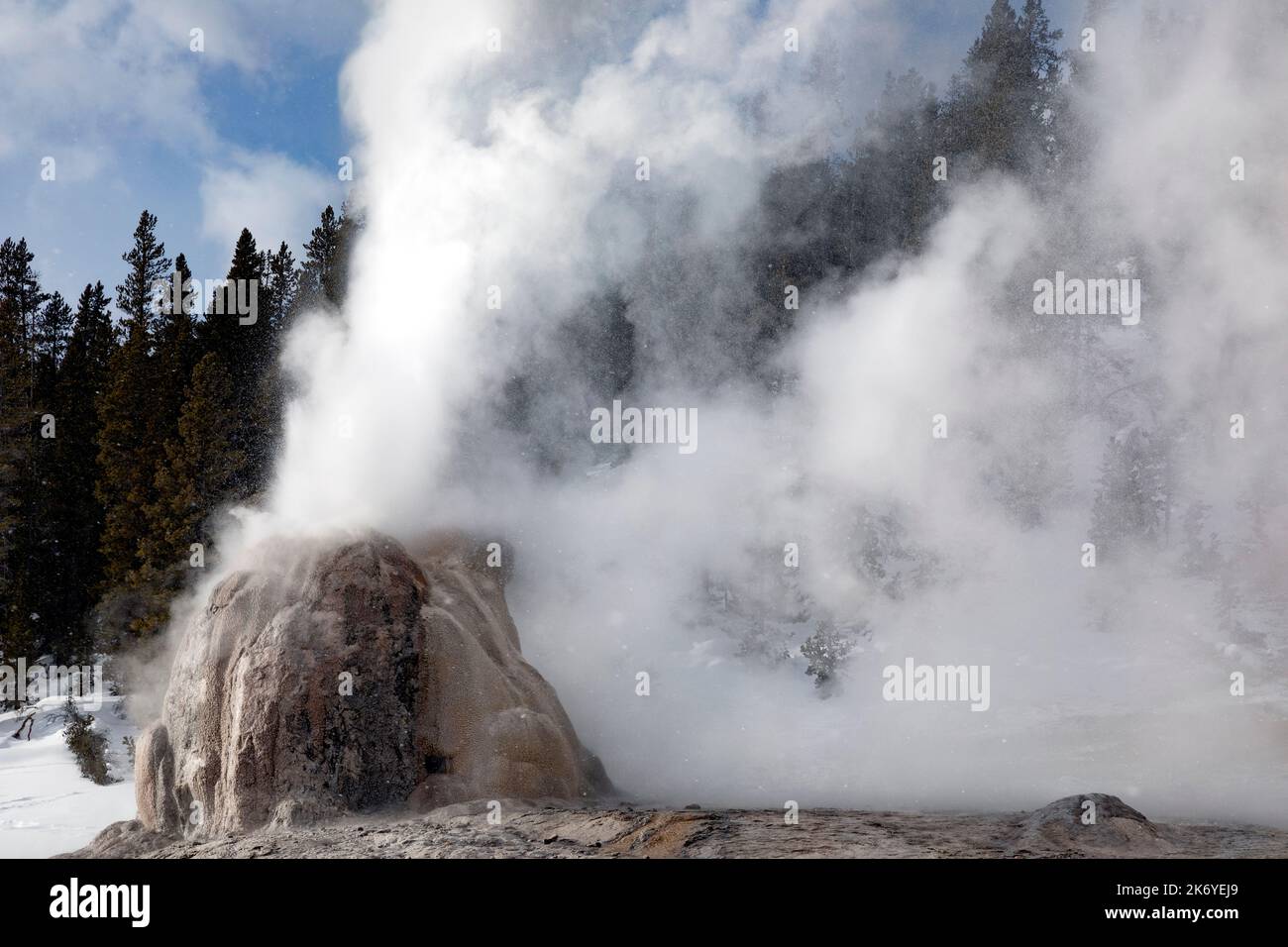 WY05092-00.....WYOMING - Lone Star Geyser erupting on a  winter day, Yellowstone National Park. Stock Photo