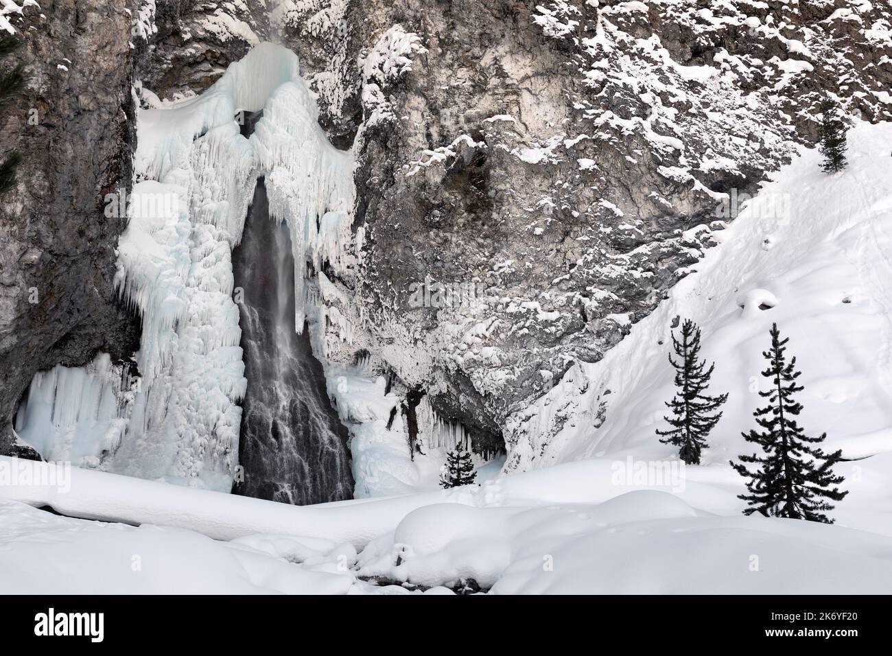 WY05103-00.....WYOMING - Frozen Fairy Falls in the Midway Geyser Basin of Yellowstone National Park. Stock Photo