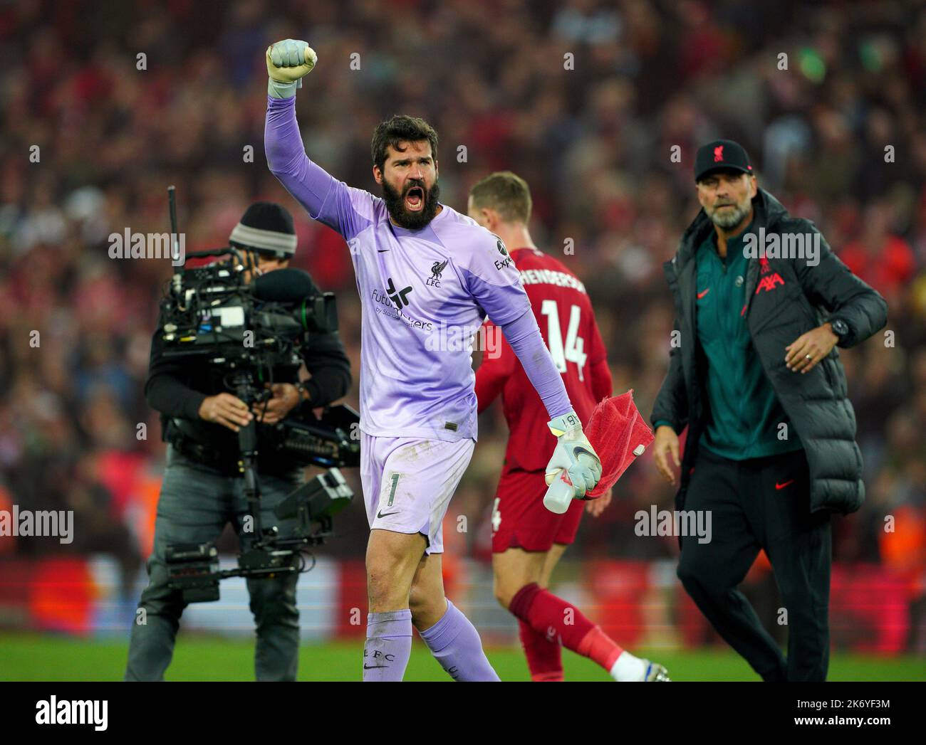 Liverpool goalkeeper Alisson Becker celebrates at full time after the ...