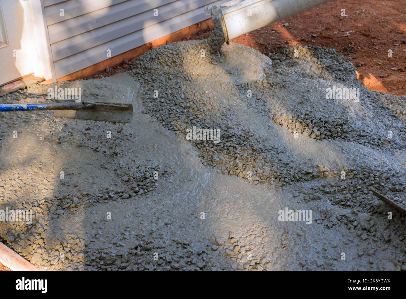At construction site near new home, we are pouring wet concrete onto