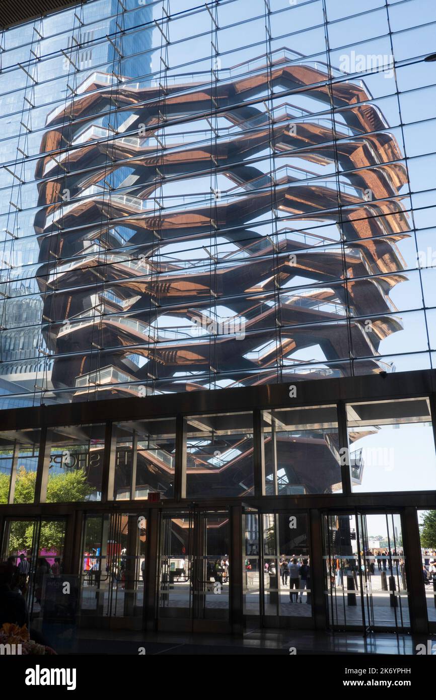 The vessel a multi storied copper clad interactive art piece as seen from the shops at Hudson yards, 2022, New York City, USA Stock Photo