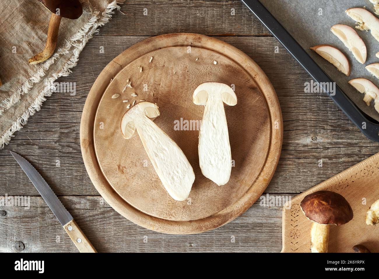 Cutting, slicing and drying fresh king bolete mushroom on a table, top view Stock Photo Alamy