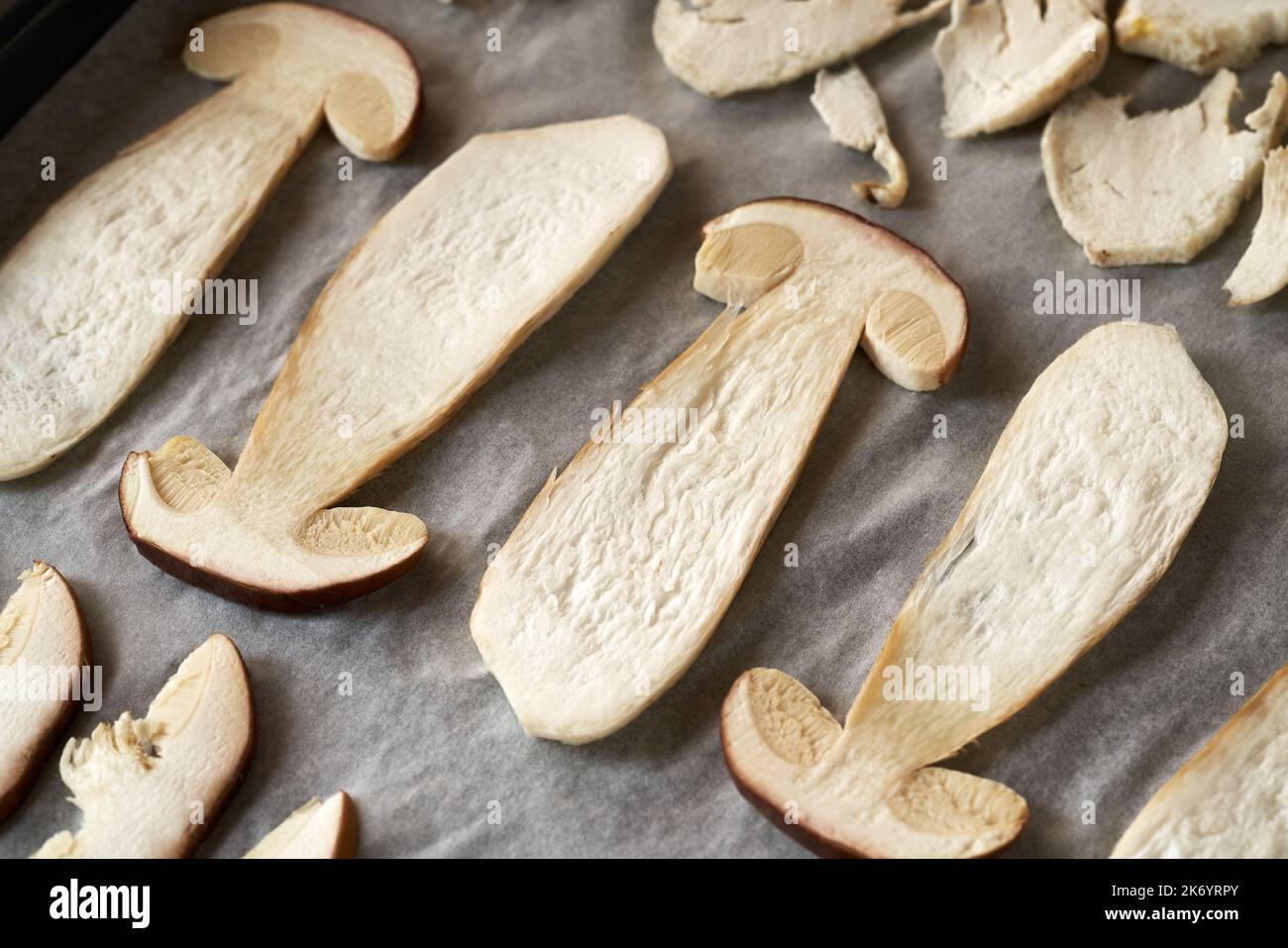 Sliced fresh wild king bolete mushroom on a paper, ready for drying, closeup Stock Photo Alamy