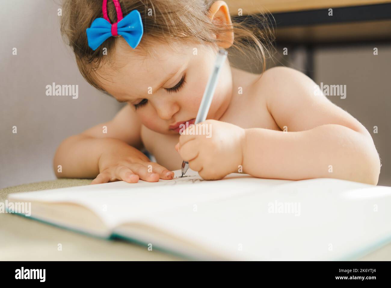 Painting girl writing book hi-res stock photography and images - Alamy