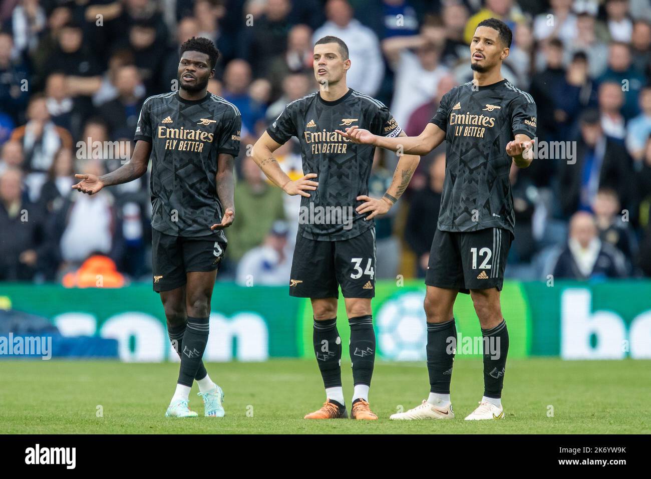 Leeds, UK. 16th Oct, 2022. William Saliba #12, Granit Xhaka #34 and Thomas Partey #5 of Arsenal react during the Premier League match Leeds United vs Arsenal at Elland Road, Leeds, United Kingdom, 16th October 2022 (Photo by James Heaton/News Images) in Leeds, United Kingdom on 10/16/2022. (Photo by James Heaton/News Images/Sipa USA) Credit: Sipa USA/Alamy Live News Stock Photo