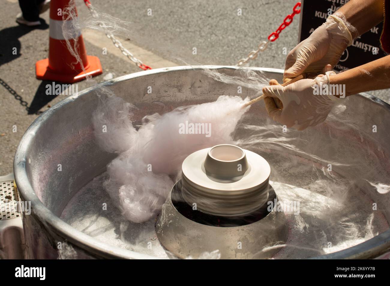 The process of making sweet cotton candy at a street market. Street