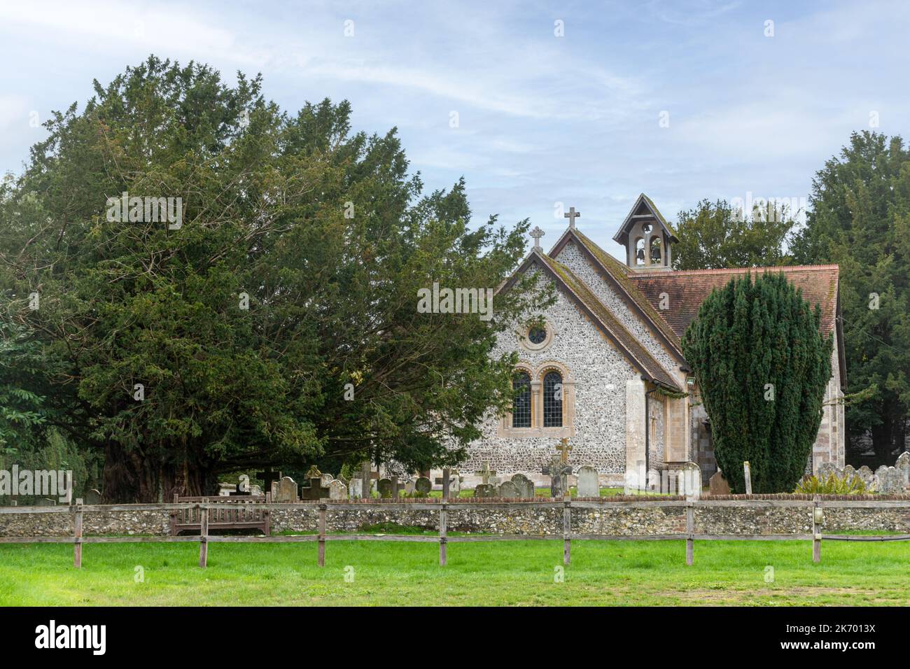 St John the Baptist Church in Itchen Abbas village, Hampshire, England, UK, with ancient yew tree Stock Photo