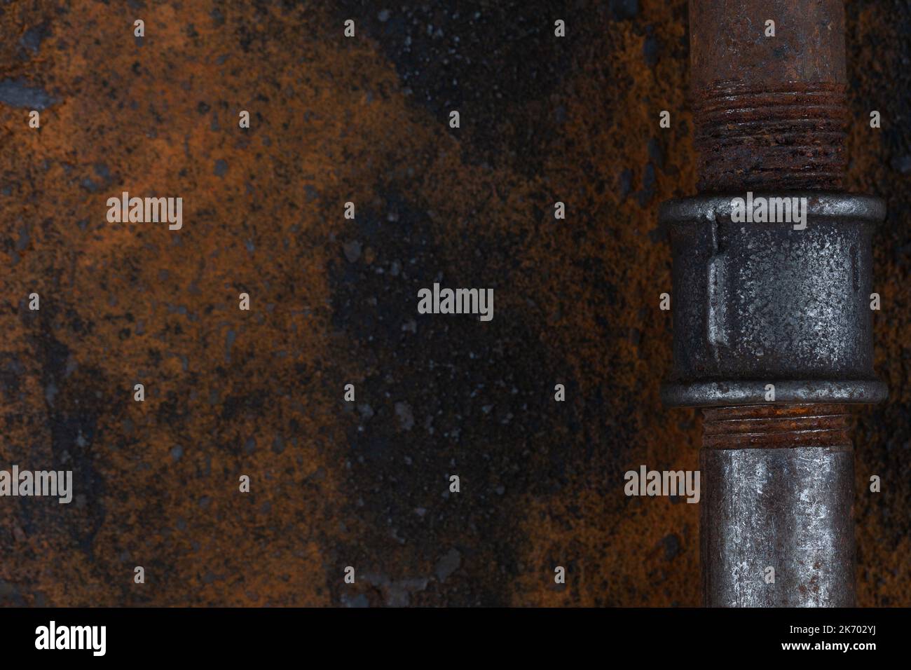 Old rusty valve pipes on rusty metal wall background Stock Photo - Alamy