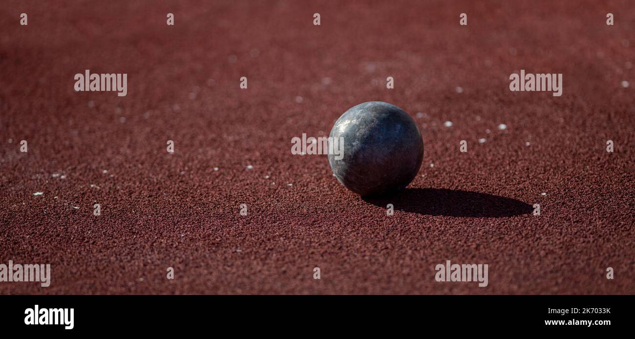 Shot put balls on stadium field. Horizontal sport theme poster, greeting cards, headers, website and app Stock Photo