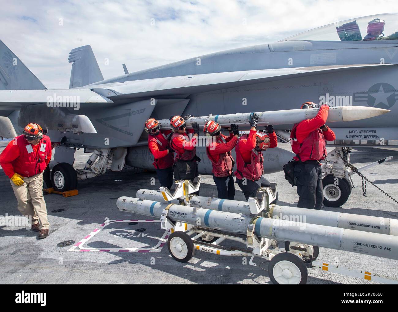 Sailors assigned to the 'Golden Warriors' of Strike Fighter Squadron (VFA) 87 transport a missile from the wing of an F/A-18E Super Hornet to an ordnance transportation cart on the first-in-class aircraft carrier USS Gerald R. Ford’s (CVN 78) flight deck during cyclic flight operations, Oct. 10, 2022. The Gerald R. Ford Carrier Strike Group (GRFCG) is deployed in the Atlantic Ocean, conducting training and operations alongside NATO Allies and partners to enhance integration for future operations and demonstrate the U.S. Navy’s commitment to a peaceful, stable and conflict-free Atlantic region Stock Photo