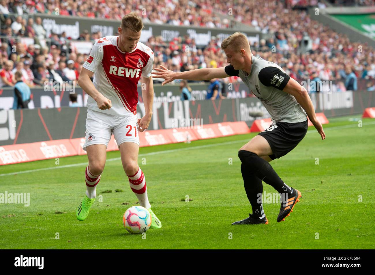 Steffen TIGGES (K) versus Frederik WINTHER (A), action, duels, soccer 1st Bundesliga, 10th matchday, FC Cologne (K) - FC Augsburg (A) 3: 2 on October 16th, 2022 in Koeln/ Germany. #DFL regulations prohibit any use of photographs as image sequences and/or quasi-video # © Stock Photo