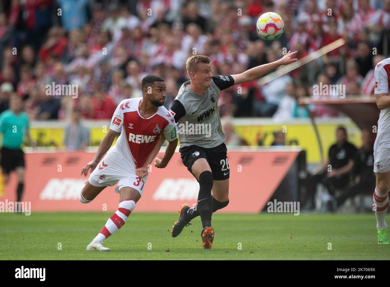 Linton MAINA (K) versus Frederik WINTHER (A), action, duels, soccer 1st Bundesliga, 10th matchday, FC Cologne (K) - FC Augsburg (A) 3: 2 on October 16th, 2022 in Koeln/ Germany. #DFL regulations prohibit any use of photographs as image sequences and/or quasi-video # © Stock Photo