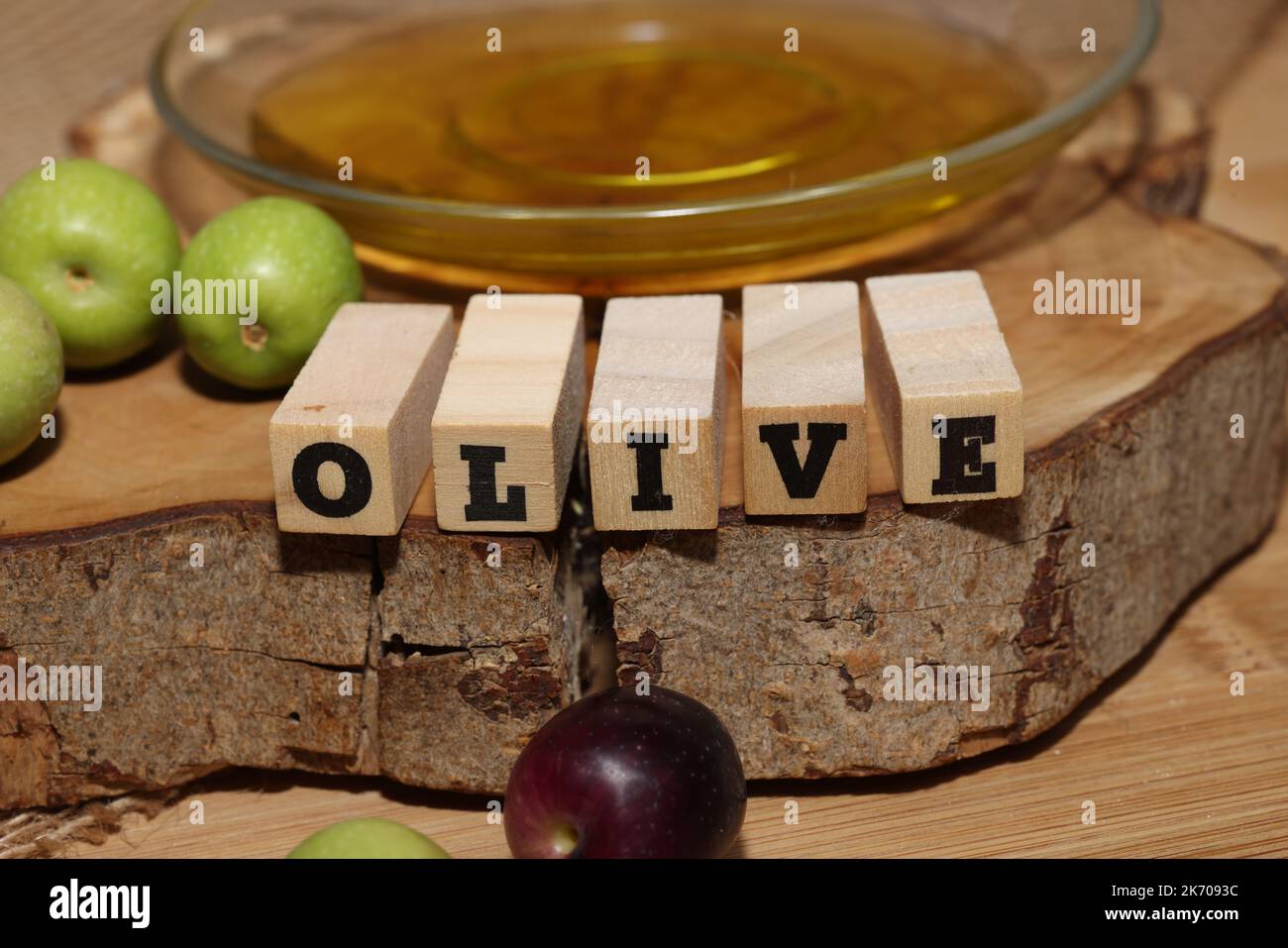 Olives and Olive Oil on wooden background Stock Photo - Alamy