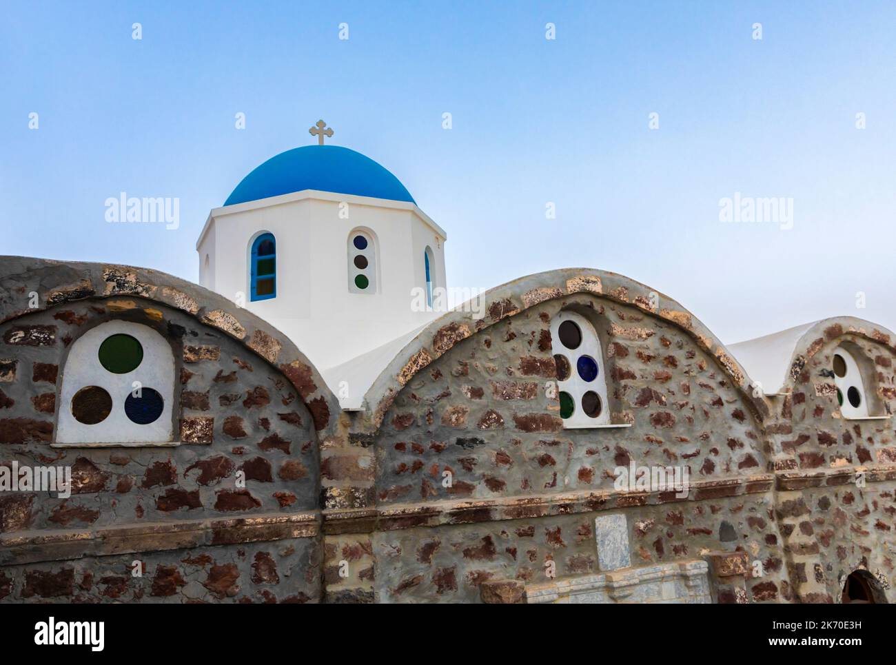 A blue-domed church in Fira on Santorini in the Greek Isles Stock Photo