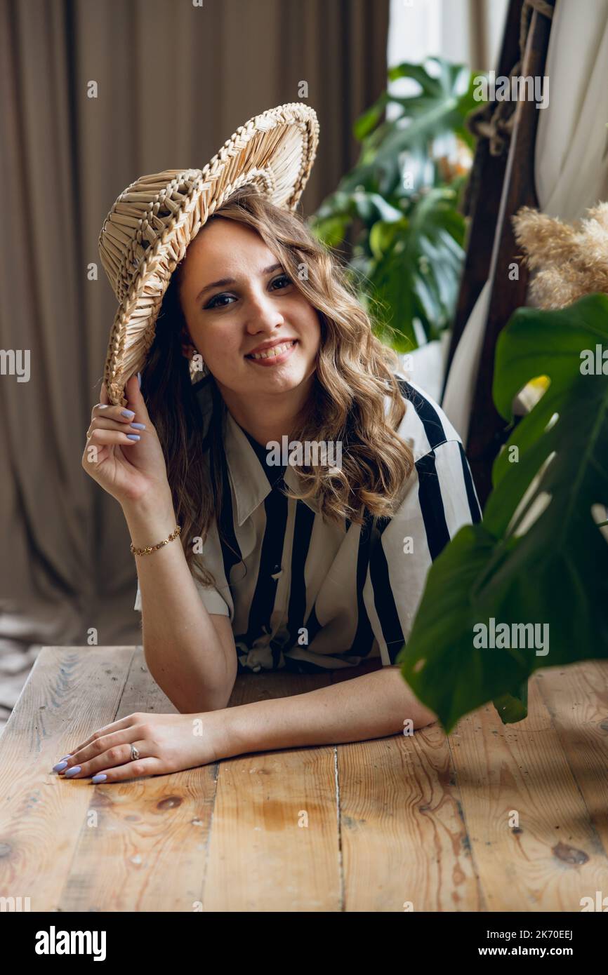 The girl with the hat is smiling Stock Photo Alamy
