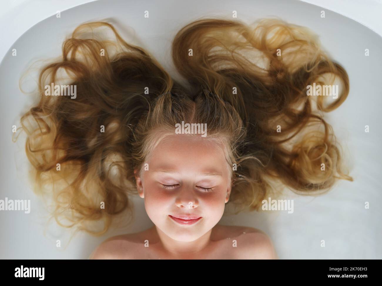 Close-up young girl hair in the bath. Stock Photo