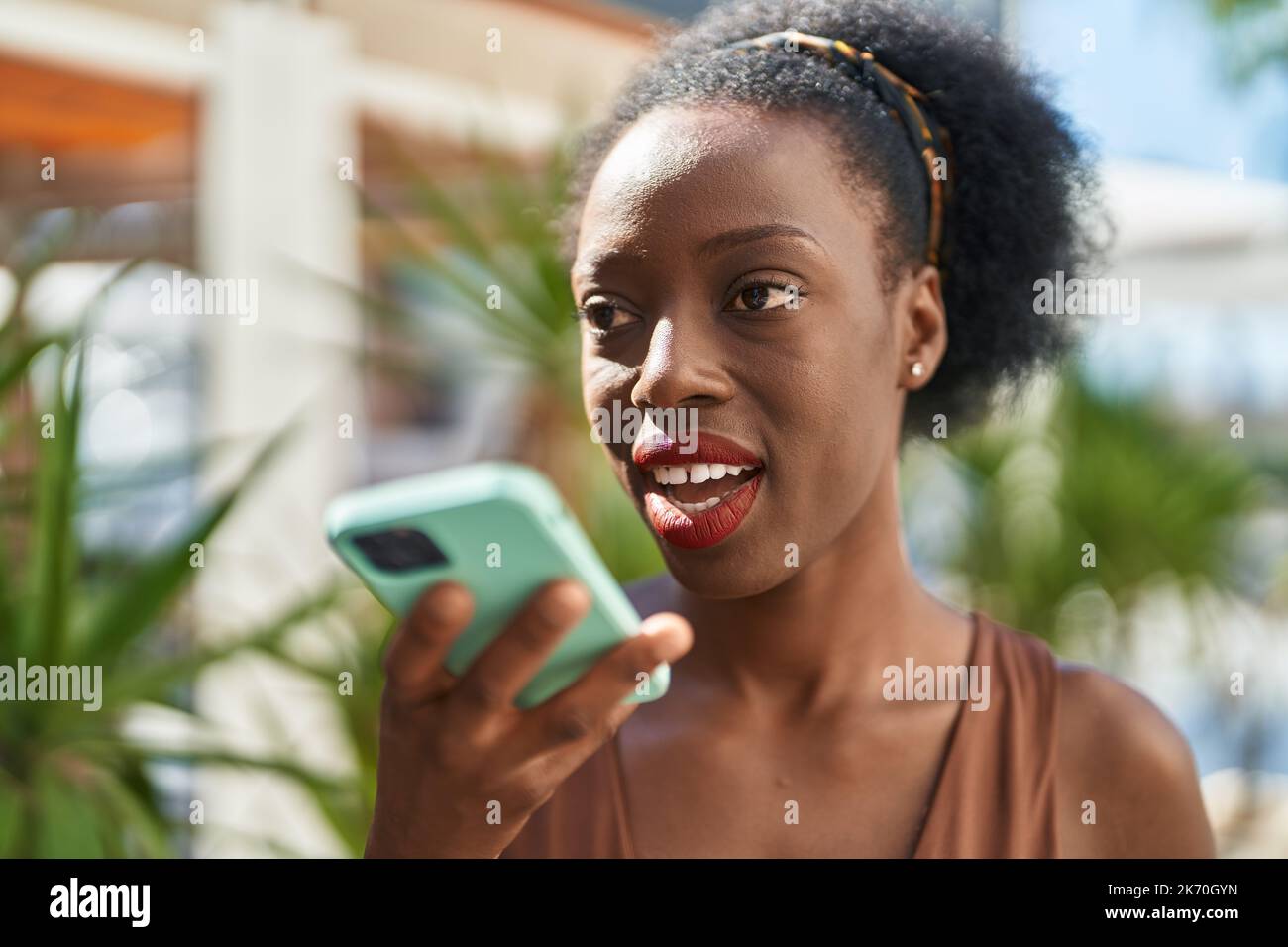 African american woman smiling confident talking on the smartphone at ...