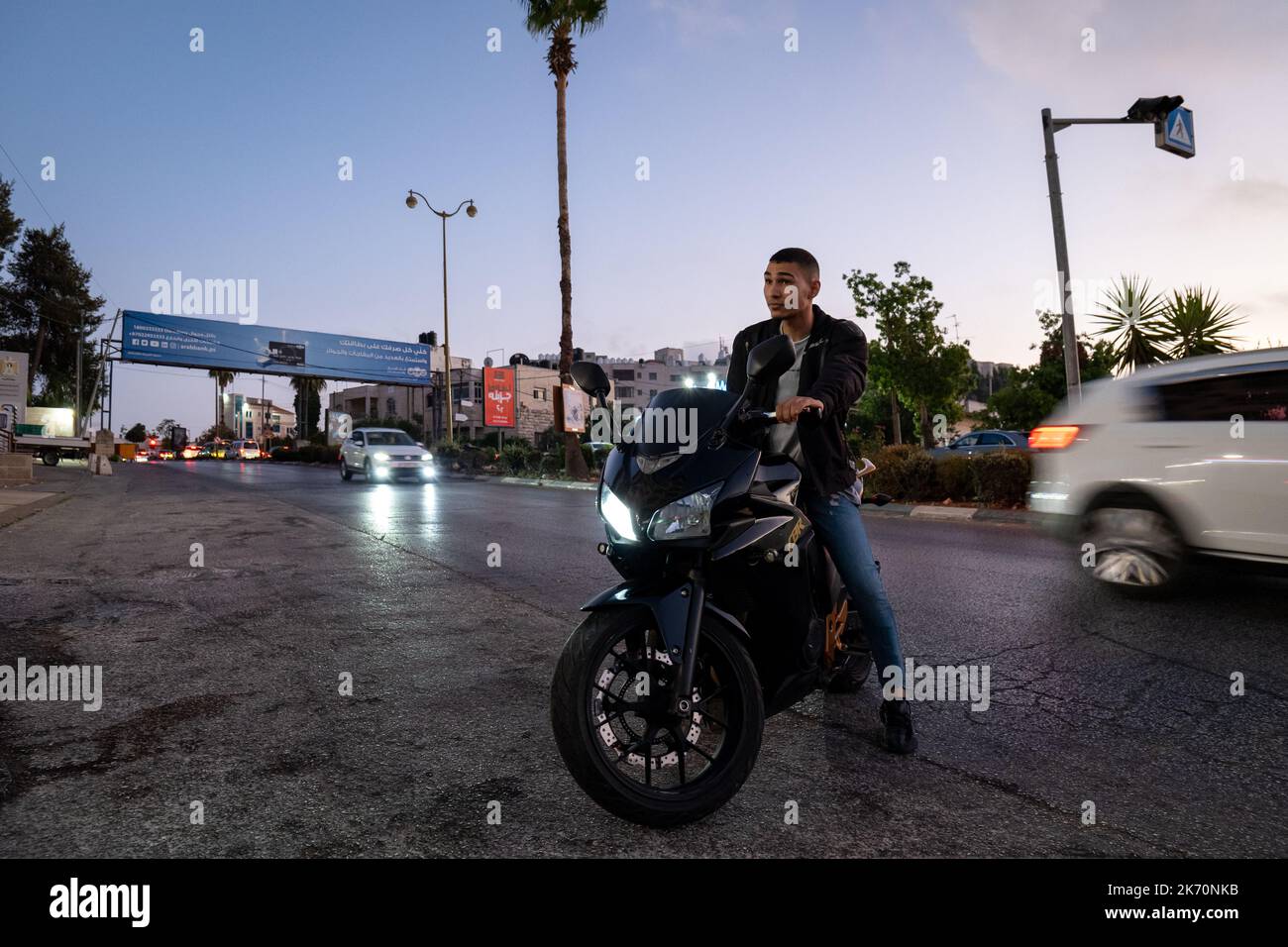 Arab man sits on a black motorcycle hi-res stock photography and images ...