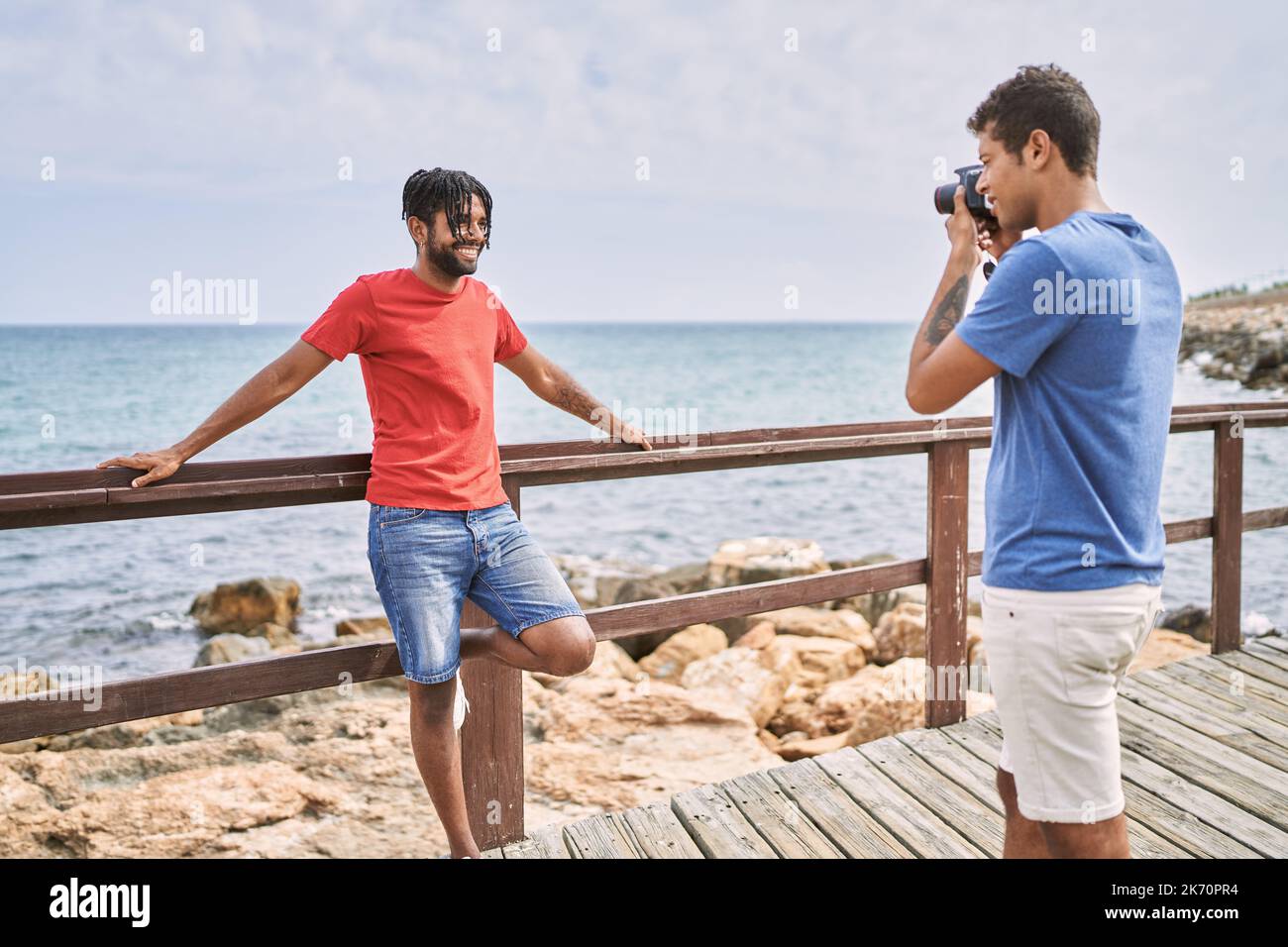 Man Using Camera Monaco African american photographer making picture to man using camera at the ...