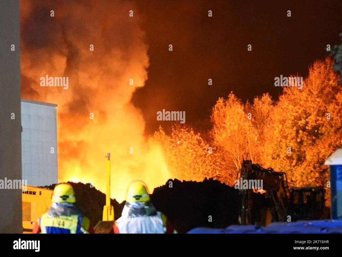 Remshalden, Germany. 16th Oct, 2022. Firefighters work on a fire in an annex of a company hall. As a police spokesman said, according to current knowledge, gas cylinders stored there had exploded. The fire did not spread to the company hall. Credit: Kohls/SDMG/dpa/Alamy Live News Stock Photo