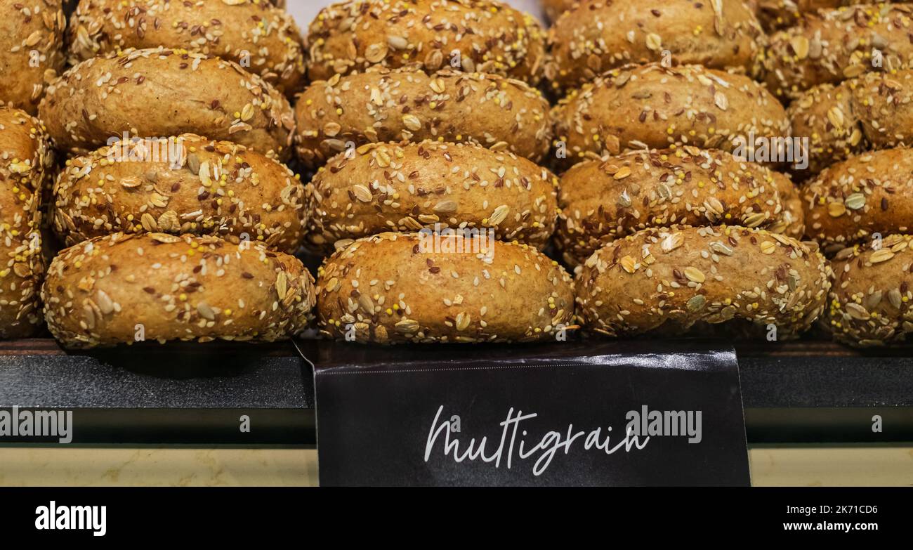 Healthy Organic Whole Grain Bagel for Breakfast. Bagels with a variety of seeds on a gray background, top view. Food background. Nobody, selective foc Stock Photo