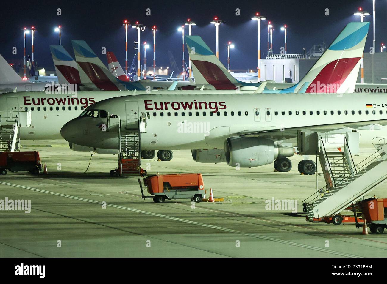 Hamburg, Germany. 17th Oct, 2022. Machines of the airline Eurowings stand dark and without crew or ground staff at night at Hamburg Airport. The Vereinigung Cockpit union has called on Eurowings pilots to walk off the job from 00:00 on Monday, (Oct. 17) to Wednesday (Oct. 19) inclusive. The industrial action has begun as planned, said a spokesman for the Vereinigung Cockpit (VC) pilots' union. No further offer had been submitted. Credit: Bodo Marks/Bodo Marks/dpa/Alamy Live News Stock Photo