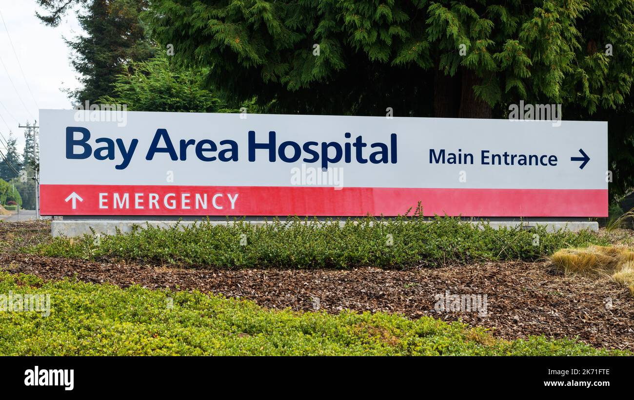 Coos Bay, OR, USA - September 18, 2022; Bay Area Hospital sign in Coos Bay Oregon with arrow for Main Entrance and Emergency Stock Photo